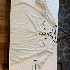 White and black dress blouse with pin up sleeve. Good Condition